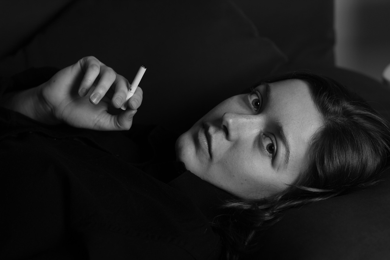 Woman, cigarette, smoking — Top Clinics for Mommy Makeovers in Washington DC